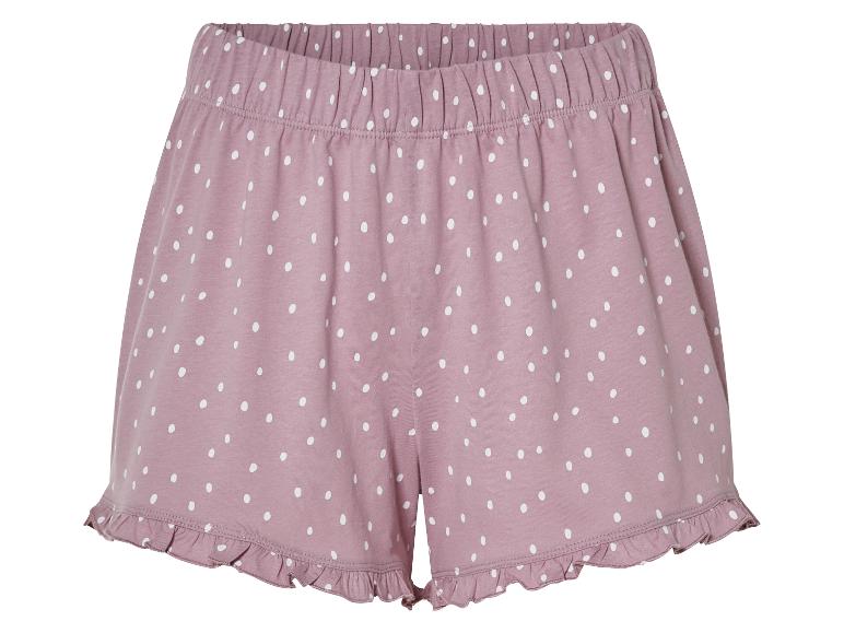 Shorts de pyjama rose à pois blancs.