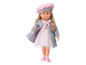 Une poupée avec un manteau gris, une robe rose et un bonnet rose.