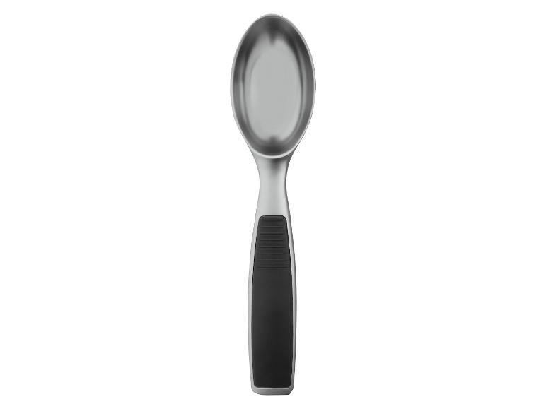 Cuillère à glace en métal avec manche noir.