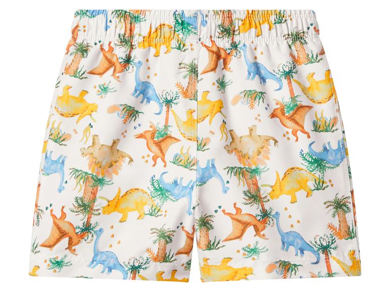 Short de bain blanc avec un imprimé coloré de dinosaures et de palmiers.