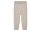 Pantalon en tricot beige avec taille élastique.