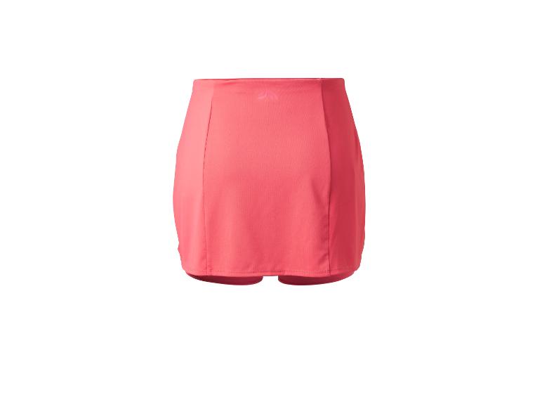 Jupe-short de sport rose corail avec un logo discret sur la ceinture.