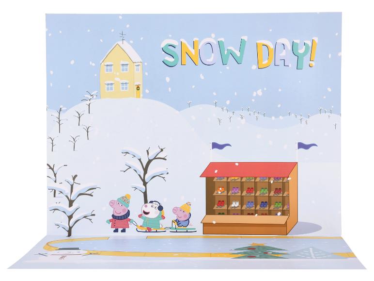 Une carte pop-up de Peppa Pig et ses amis faisant du patin à glace un jour de neige.