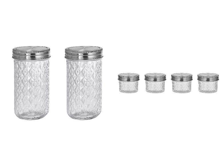 Deux grands et quatre petits bocaux en verre avec couvercles métalliques, à motif diamant.