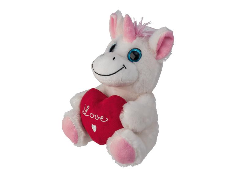 Une licorne en peluche blanche tenant un cœur rouge avec l'inscription 'Love'.