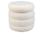 Pouf rond en tissu bouclé blanc avec un design superposé.