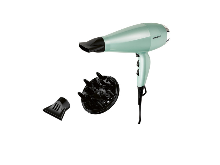 Un sèche-cheveux SilverCrest vert clair avec concentrateur et diffuseur.