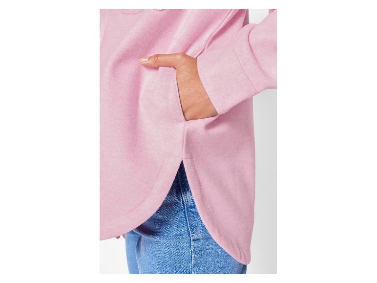Un sweat-shirt rose oversized avec un ourlet bas.