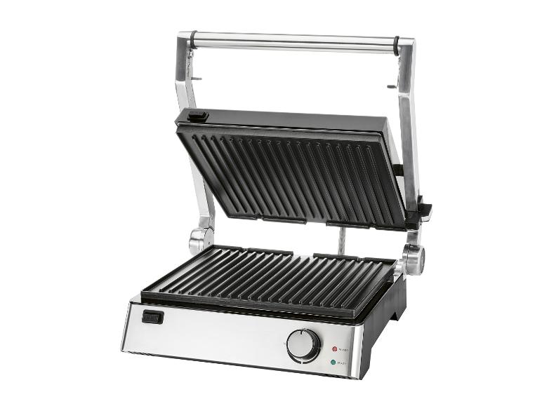 Grill électrique ouvert avec plaques de cuisson nervurées et commandes sur le devant