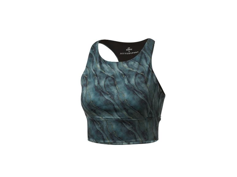 Haut de sport Crivit Jette Sport avec motif bleu et détails dorés.