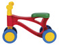 Une draisienne rouge avec des roues bleues et une selle verte de la marque Vtech.