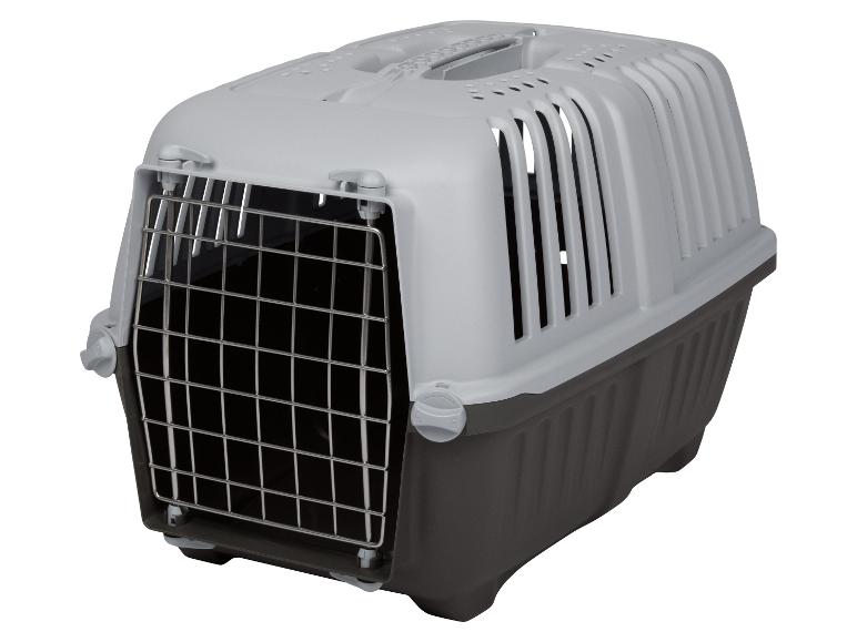 Une cage de transport en plastique pour animaux de compagnie.