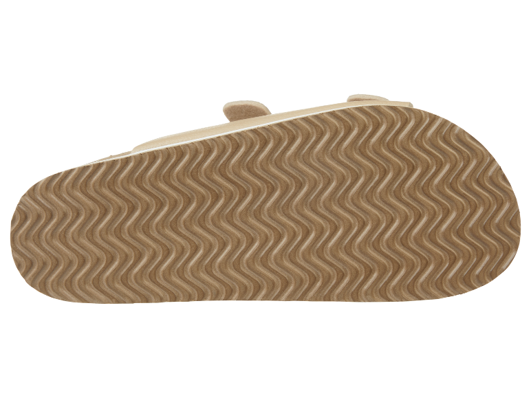 Semelle de sandales enfant beige avec motif ondulé.