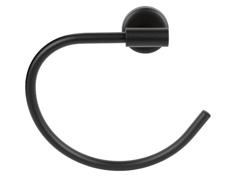 Un porte-serviettes noir en forme d'anneau, fixé au mur.