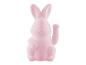 Un jouet de lapin rose.