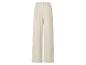 Pantalon beige large avec taille élastique.
