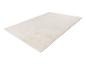 Tapis rectangulaire de couleur crème unie, posé à plat sur un fond blanc.