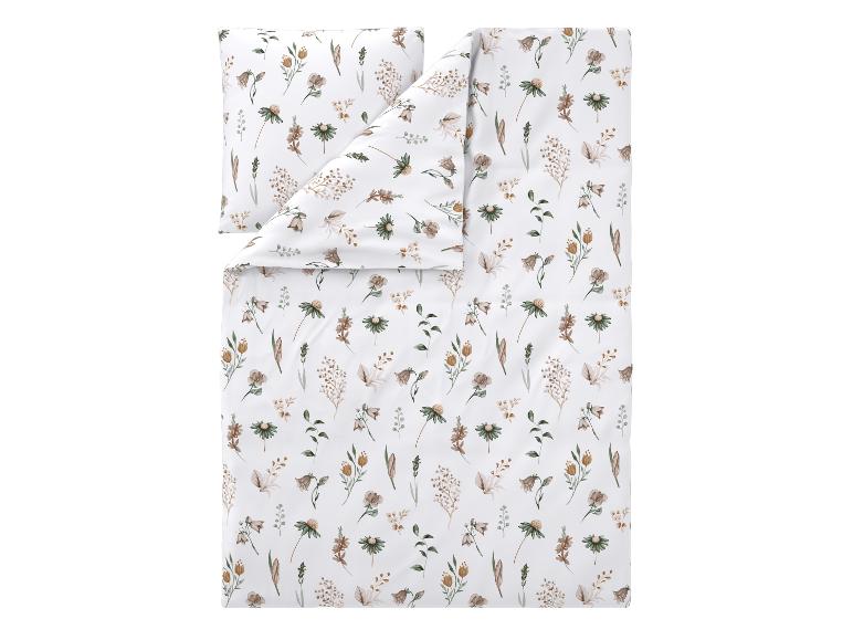 Parure de lit blanche avec oreiller et couette, décorée de motifs floraux beiges et verts.