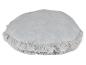 Coussin rond gris à franges.