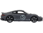 Voiture de sport miniature grise avec le numéro 60 sur le côté.