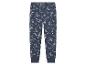 Pantalon de pyjama bleu pour enfants avec un motif de dinosaures.