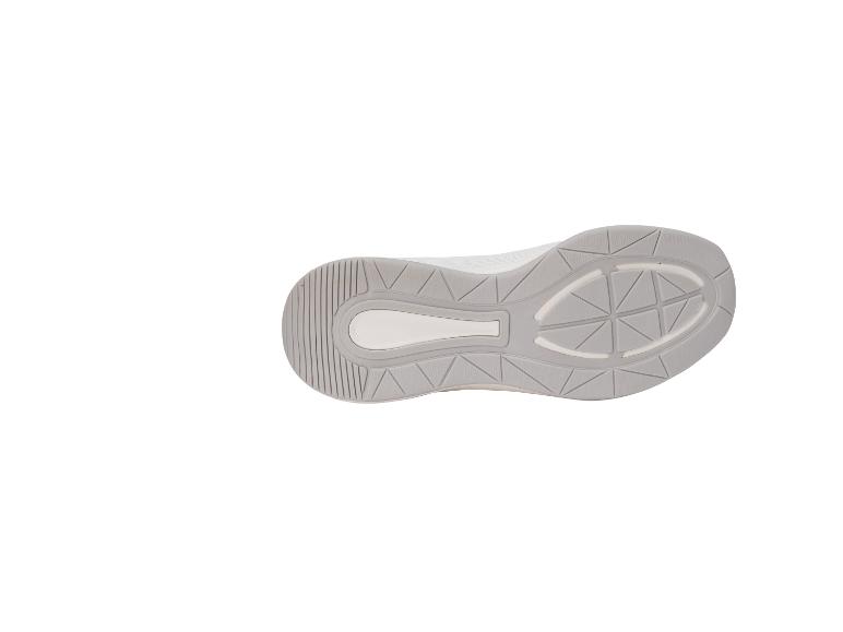 Semelle de chaussure de sport grise avec détails géométriques et texture.