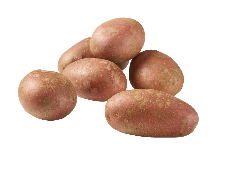 Un tas de pommes de terre rouges sur fond noir.