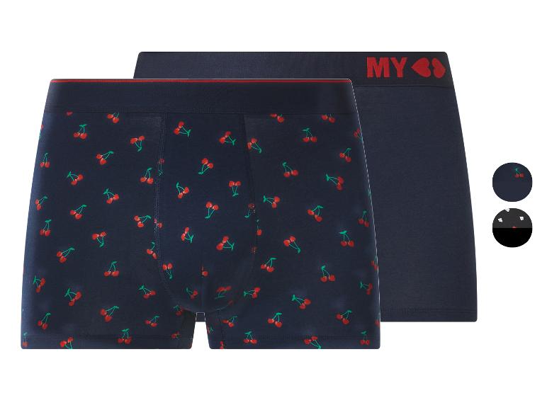 Deux boxers bleu marine, un à motif cerises et un uni avec le logo 'MY'.