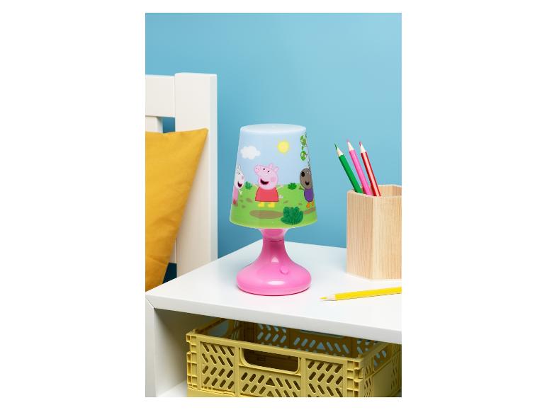 Lampe de table pour enfants avec personnages de dessins animés, crayons et caisse de rangement.