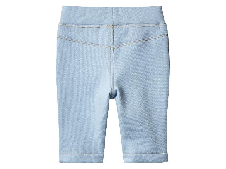 Legging enfant bleu clair avec surpiqûres.