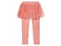 Leggings roses avec une jupe en tulle scintillante.