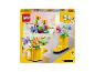 LEGO Creator 3 en 1 avec un bâtiment, une botte jaune et des oiseaux.