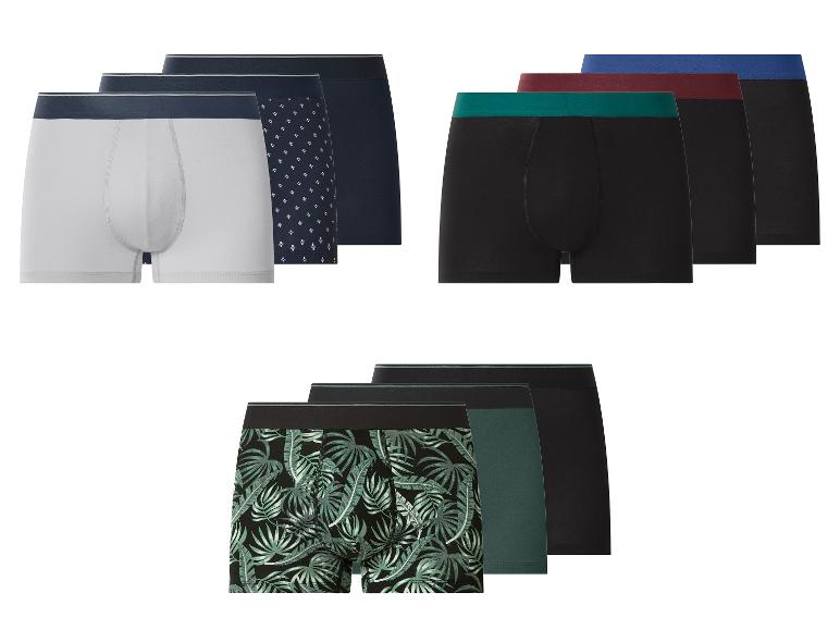 Boxers pour hommes de différentes couleurs et motifs, y compris blancs, noirs, avec des motifs géométriques et de feuilles.