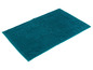 Un tapis de bain de couleur bleu foncé avec une texture douce.