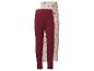 Deux leggings bébé: un bordeaux uni et un crème à motif floral.