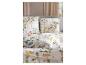 Parure de lit et oreillers blancs avec motif floral coloré dans une chambre.