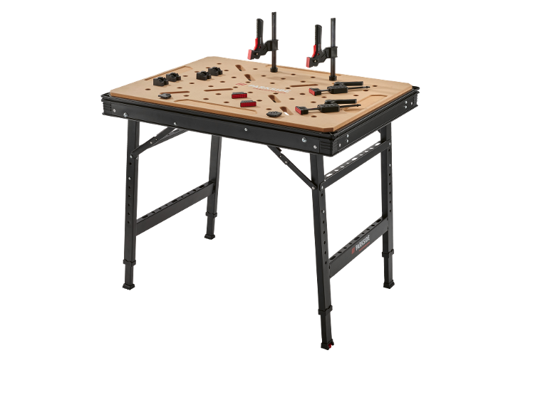 Établi pliant avec serre-joints et accessoires sur fond noir.