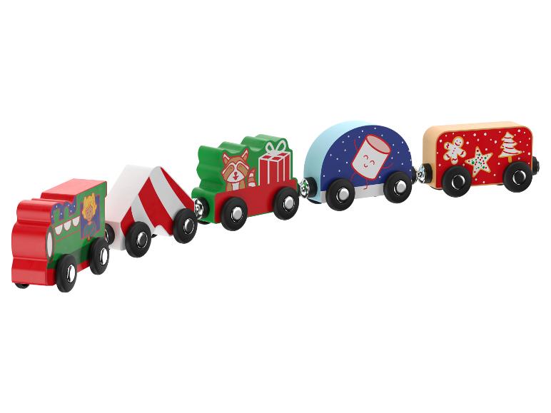 Un train de jouet en bois sur le thème de Noël.