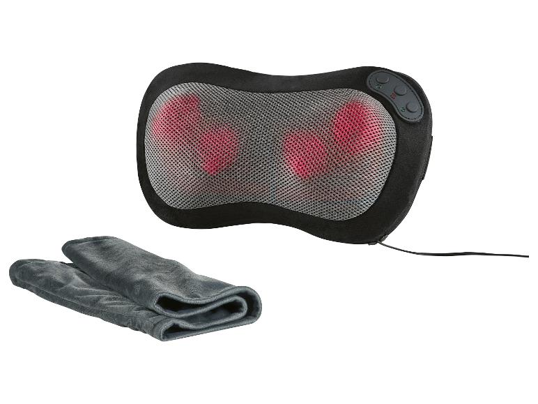 Coussin de massage électrique noir avec chaleur et commandes, accompagné d'une serviette grise.