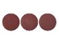 Trois disques abrasifs ronds de couleur marron sur fond blanc.
