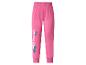 Pantalon de jogging rose pour enfant avec imprimé tropical et texte décoratif.