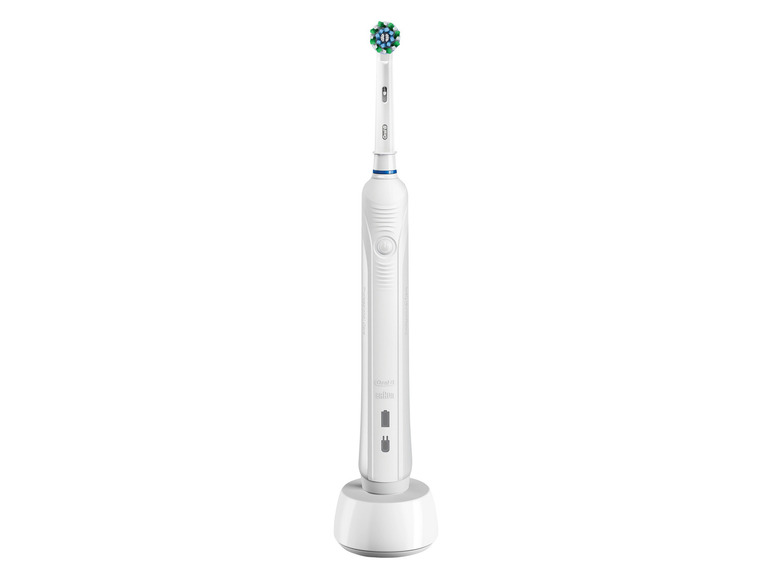 Une brosse à dents électrique Oral-B Braun sur une station de charge.