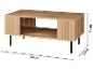 Table basse en bois avec détails nervurés et pieds noirs, mesurant 92x50x40 cm.