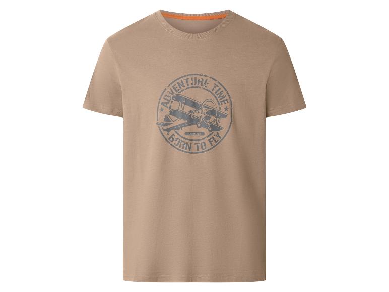T-shirt beige avec un motif d'avion gris et le texte 'ADVENTURE TIME BORN TO FLY'.