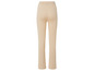 Pantalon beige en tricot à jambes larges.