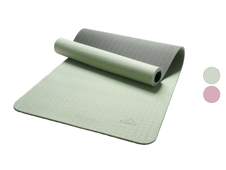 Tapis de yoga CRIVIT vert clair et gris, partiellement roulé, avec échantillons de couleur.