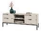 Meuble TV blanc avec tiroirs cannelés, pieds noirs et décorations