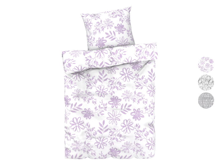 Parure de lit fleurie lilas avec taie d'oreiller assortie.