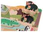 Puzzle en bois avec des animaux africains comme un éléphant, un crocodile, un zèbre et des chimpanzés.