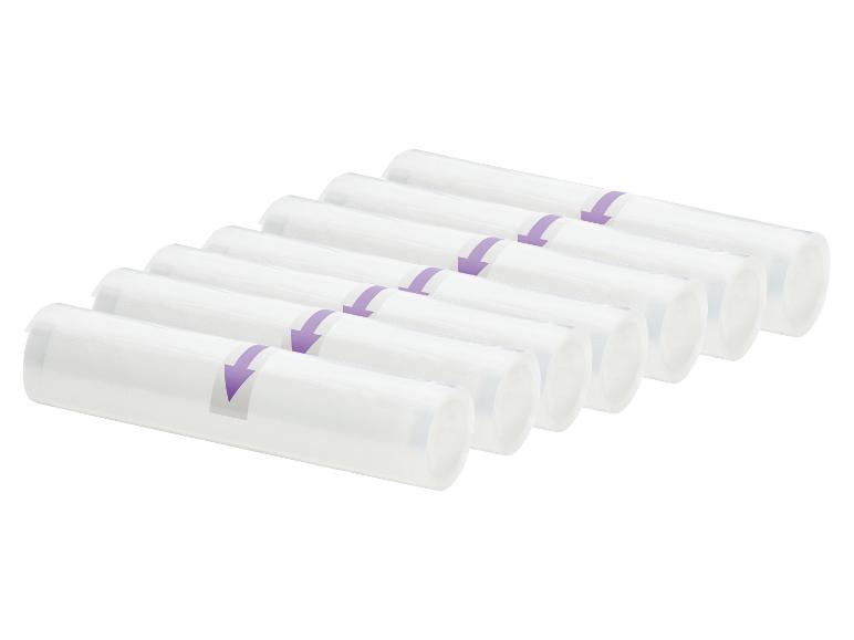 Rangées de rouleaux de film blanc pour emballage sous vide avec flèches violettes.